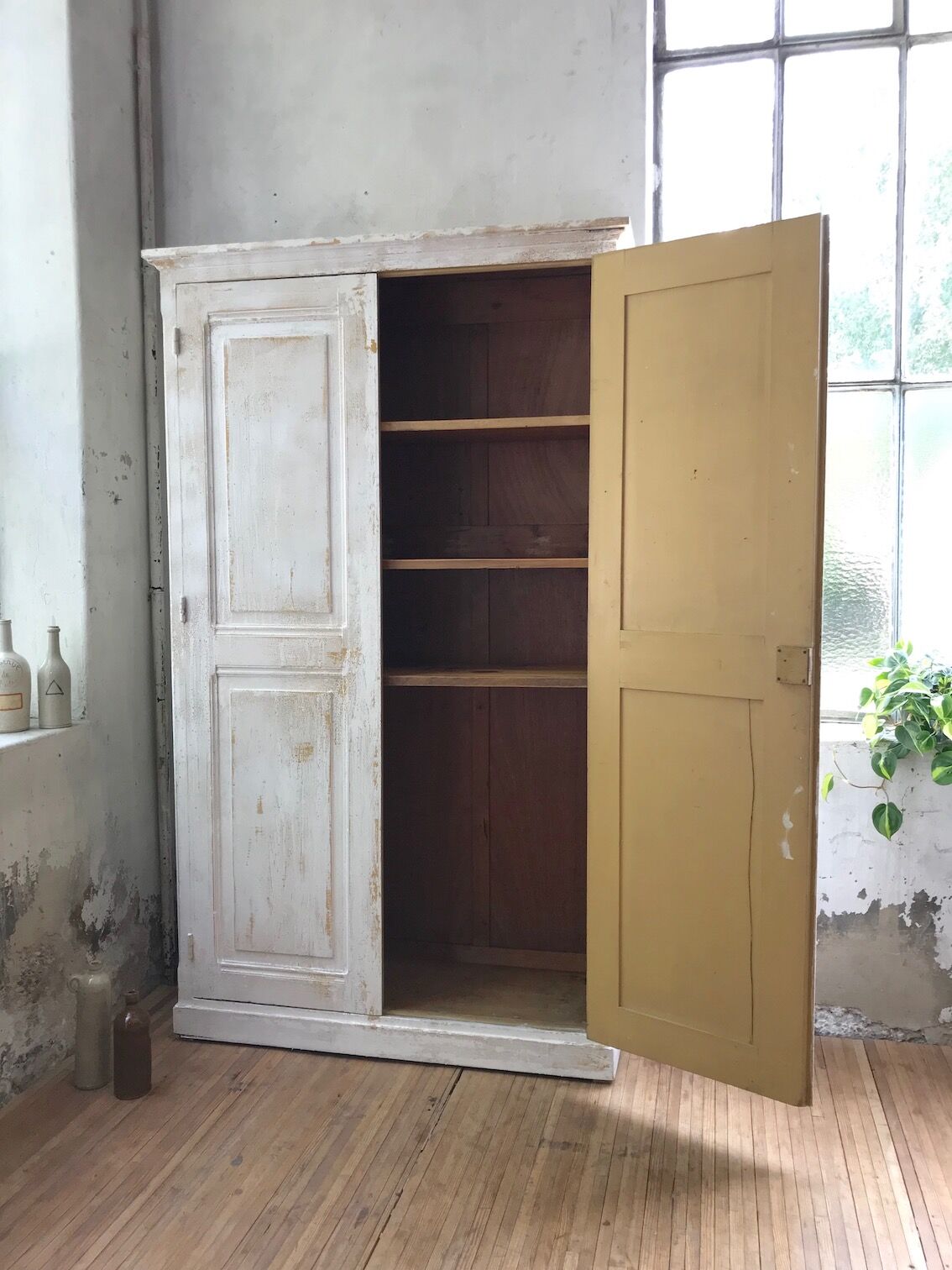 Antique wardrobe in patinated pine