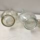 Lot of 2 old glass and tin condiment service bottles and corks
