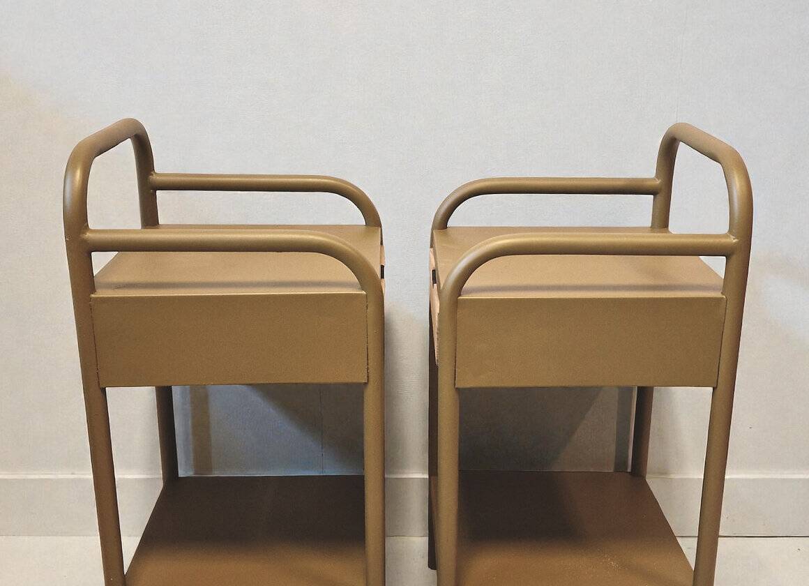 Old ochre metal bedside tables from a boarding school.