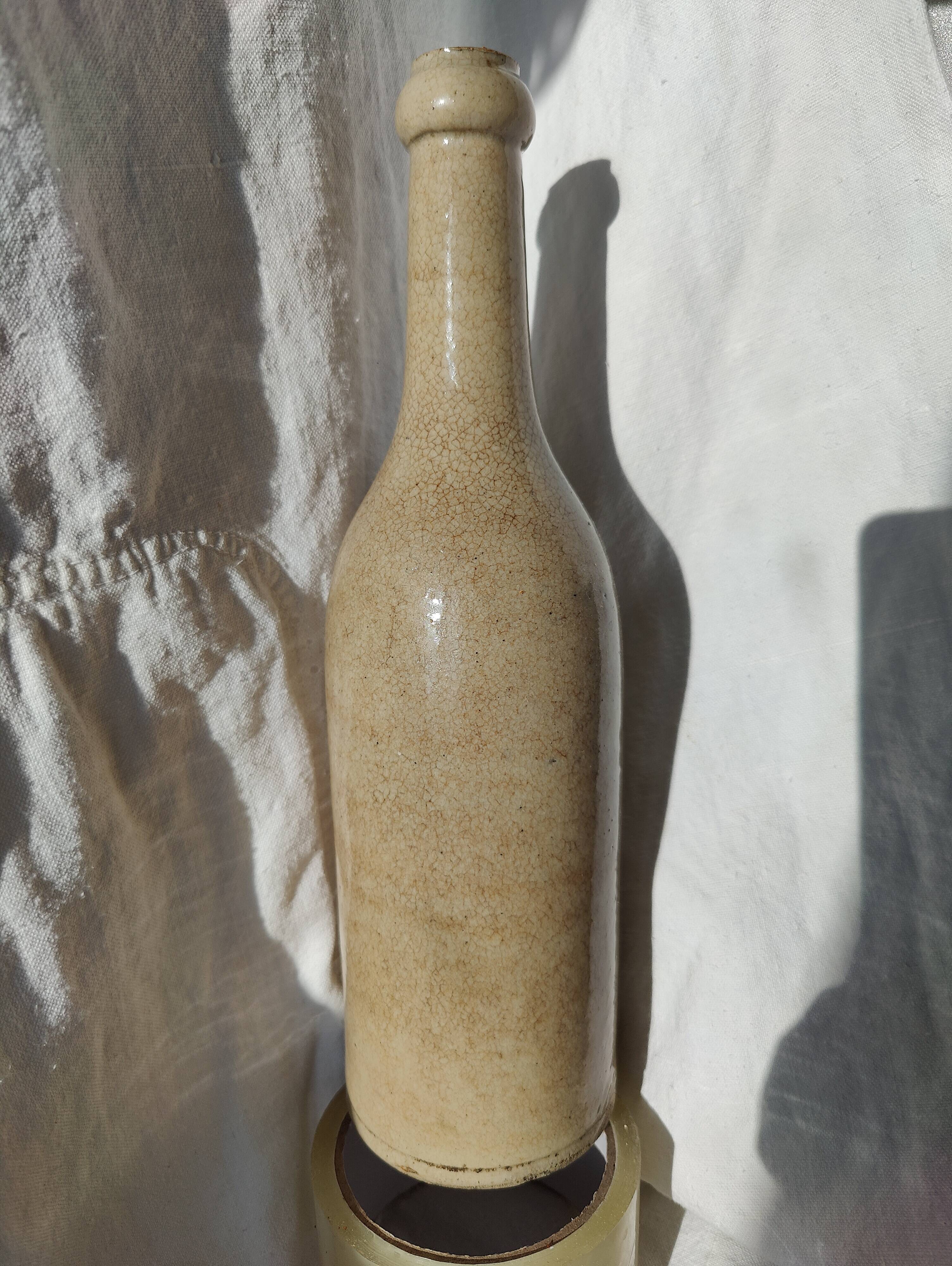 Vintage enamelled stoneware bottle