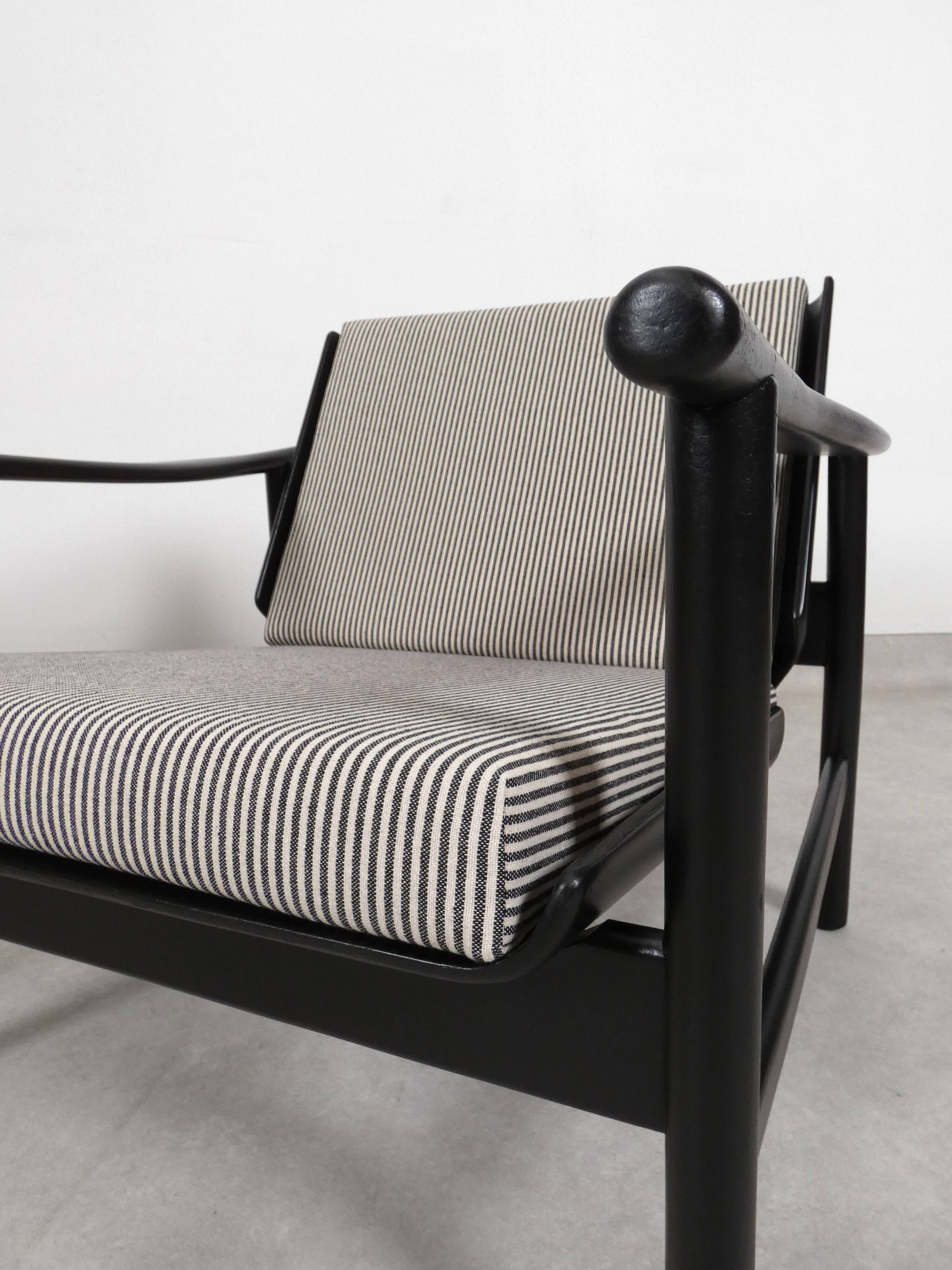 2x wooden Scandinavian arm chairs