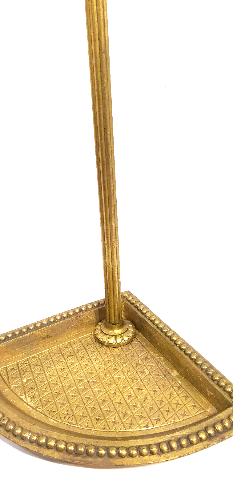 Old brass umbrella door triangular base mounted on column
