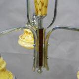 Antique Art Deco chandelier with three glass lampshades.