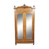 Armoire a miroirs style louis XVI en noyer a patine blonde vers 1880