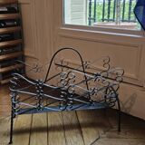 Vintage black wrought iron magazine rack
