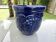 Wall pot in glazed blue terracotta with a grape motif, 1970s.