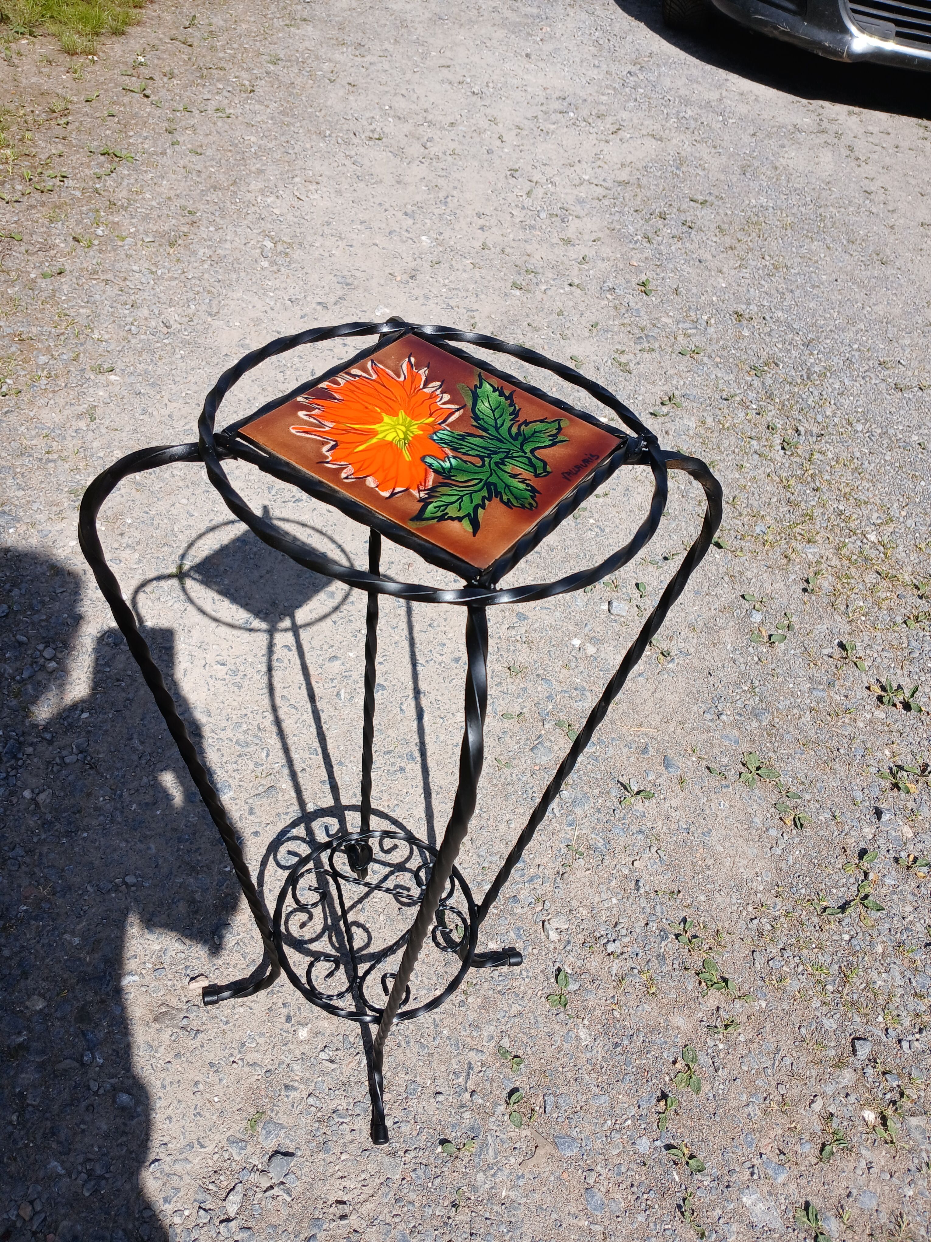 Vintage plant stand with Vallauris pottery.
