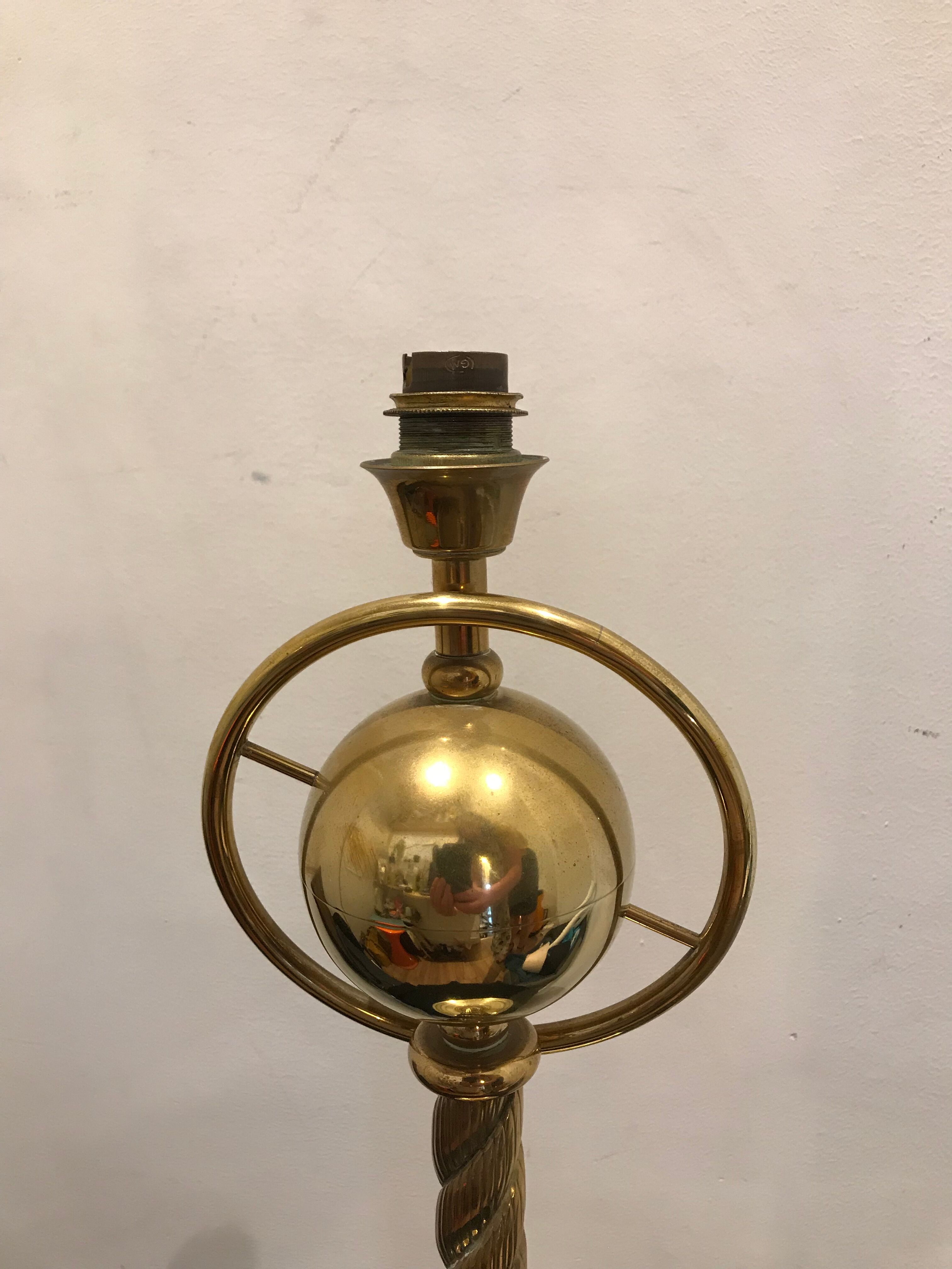 Brass lamp with removable ring around a globe