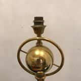 Brass lamp with removable ring around a globe