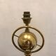 Brass lamp with removable ring around a globe