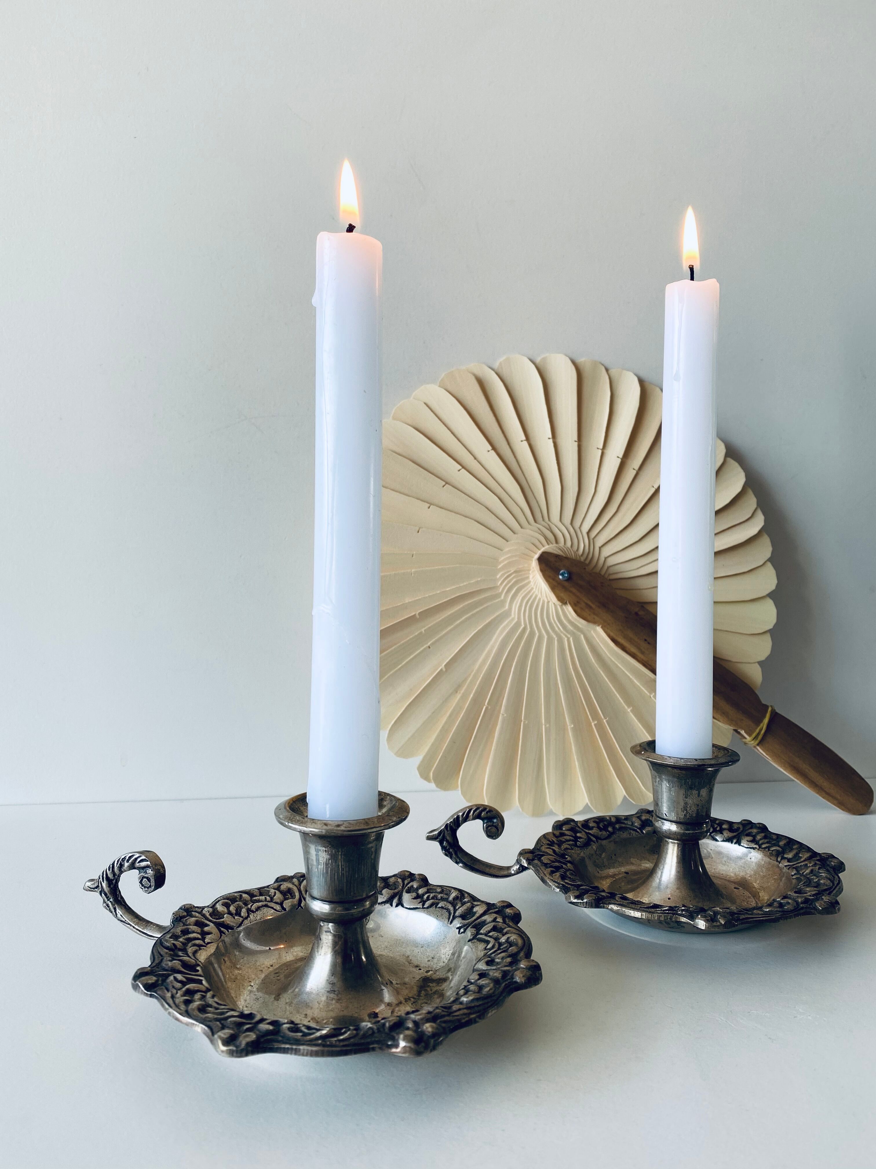 Pair of silver metal candlesticks
