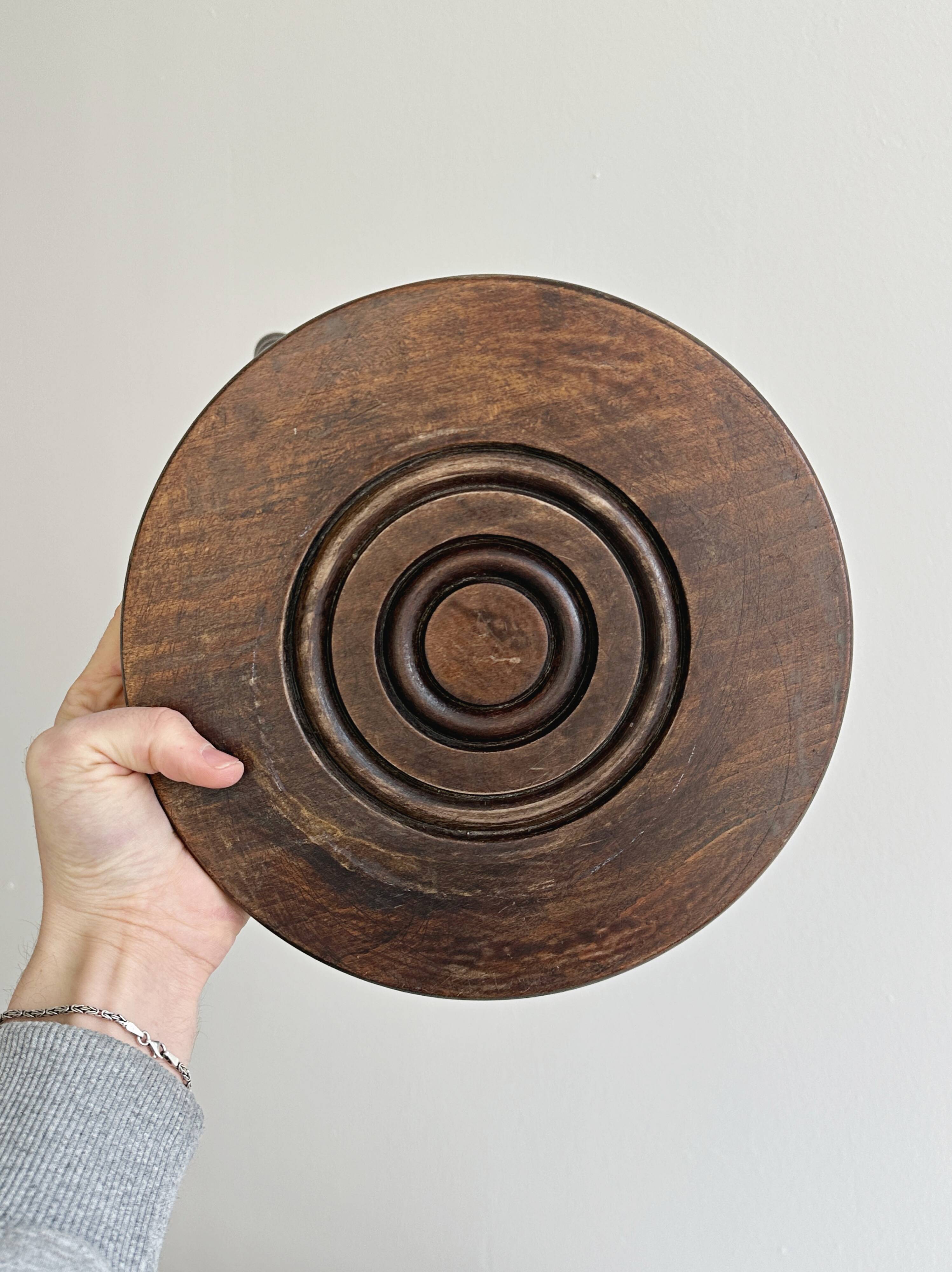 Antique three-legged twisted wooden stool