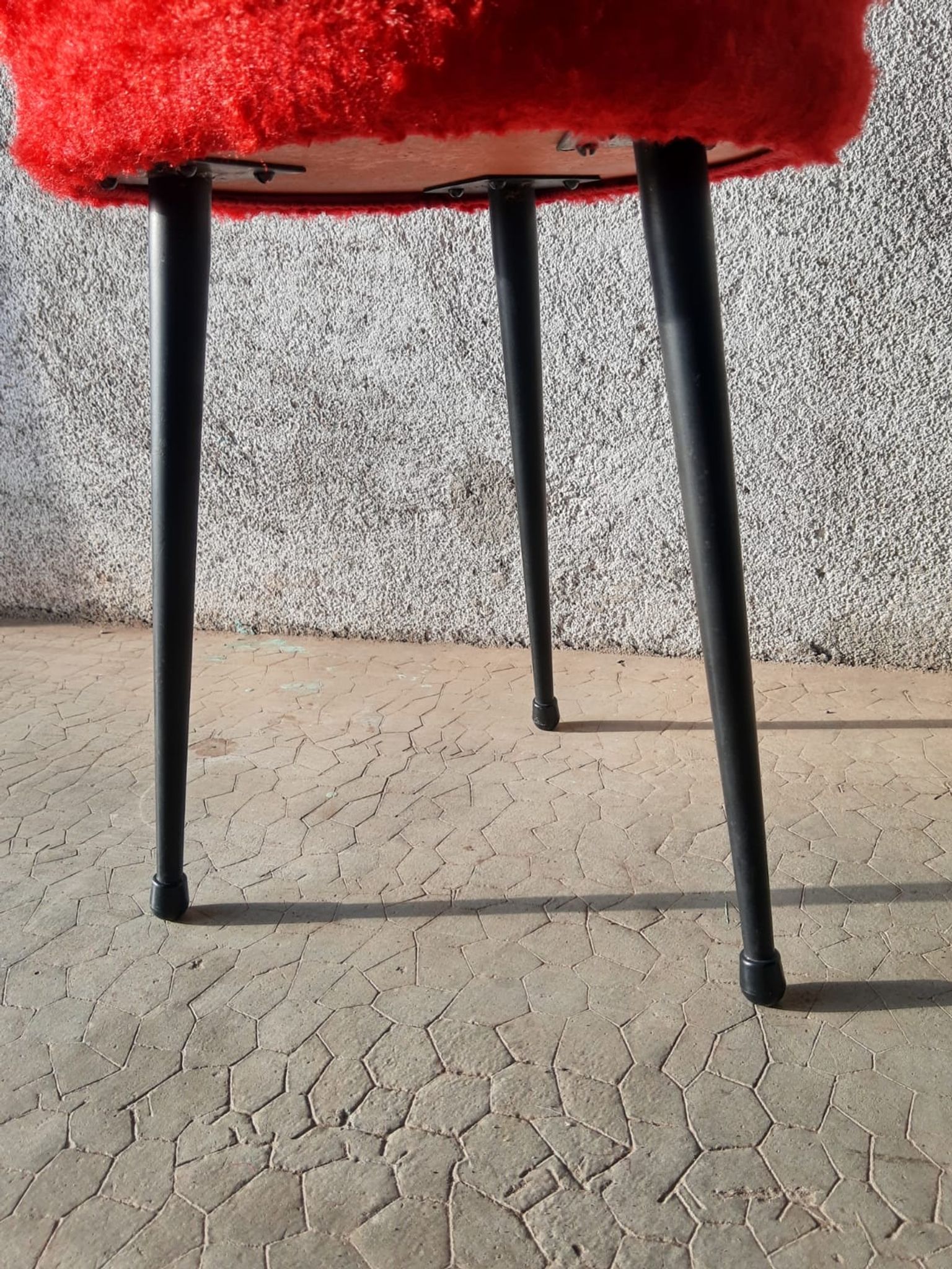 Tripod stool with vintage red moumoute seat