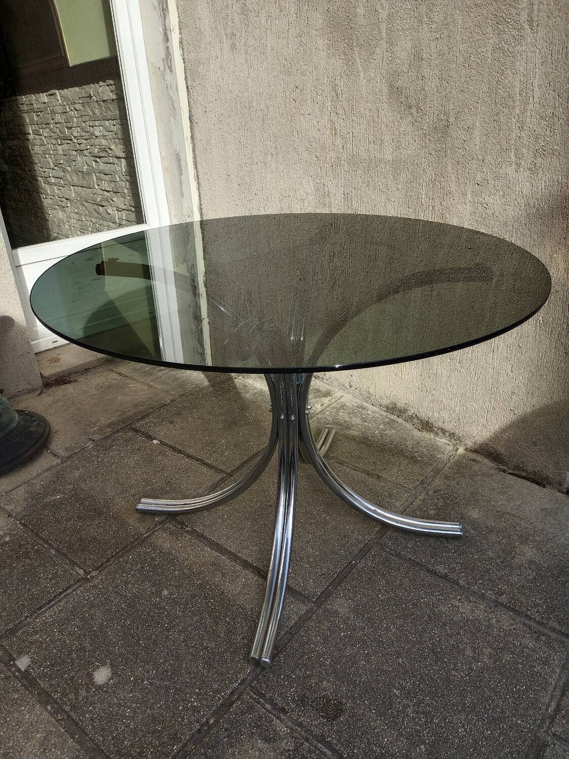 Chromed metal and smoked glass table