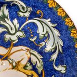 Large italian earthenware dish with putti decor in the taste of urbino