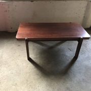Mid-century coffee table in brown wood from the 1970s, rectangular top with rounded corners.