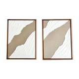 Diptych relief panels in linen and white.