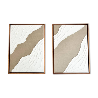 Diptych relief panels in linen and white.