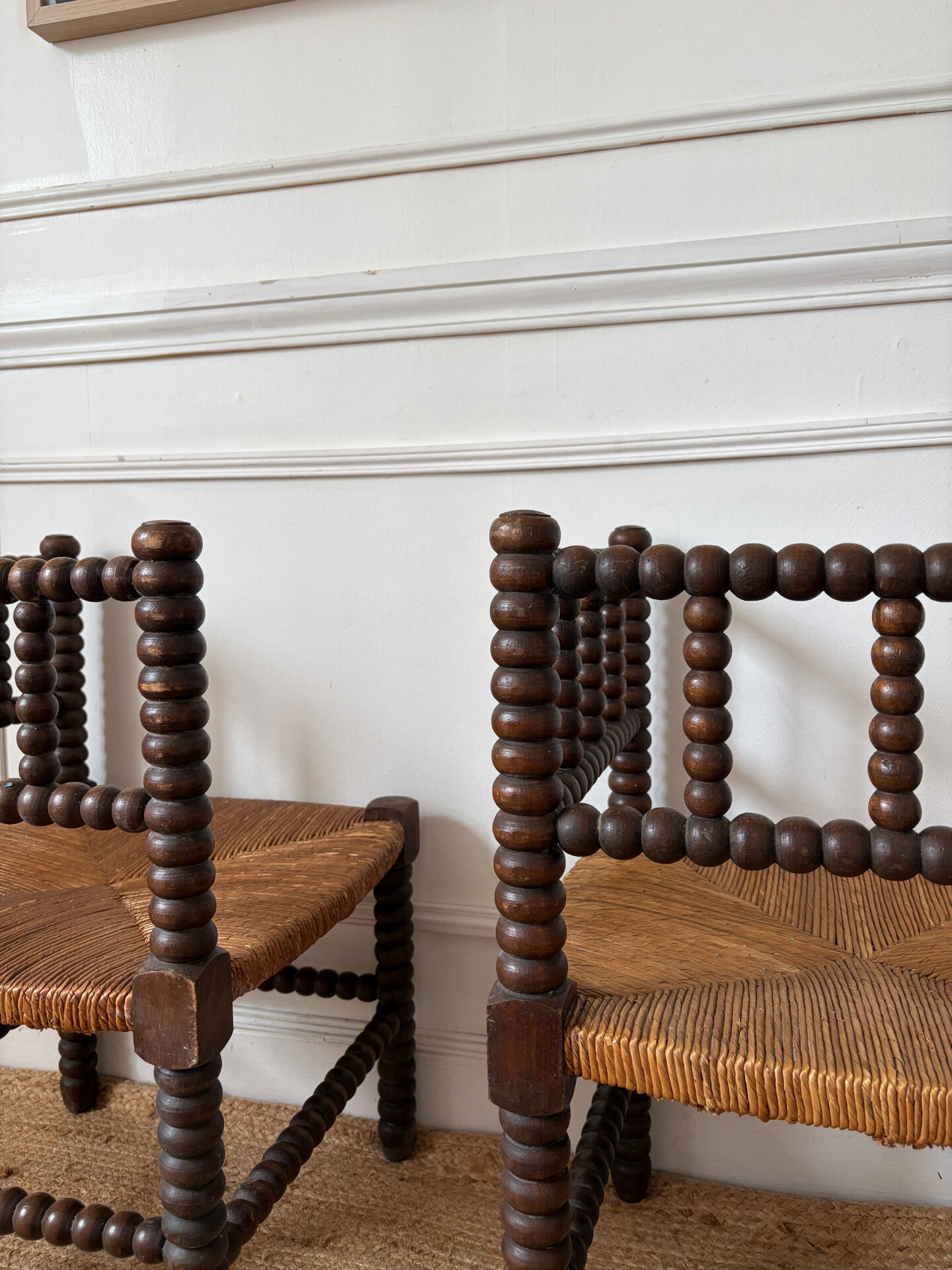 Pair of rush-seated chairs by the fireside "bobbin"