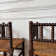 Pair of rush-seated chairs by the fireside "bobbin"
