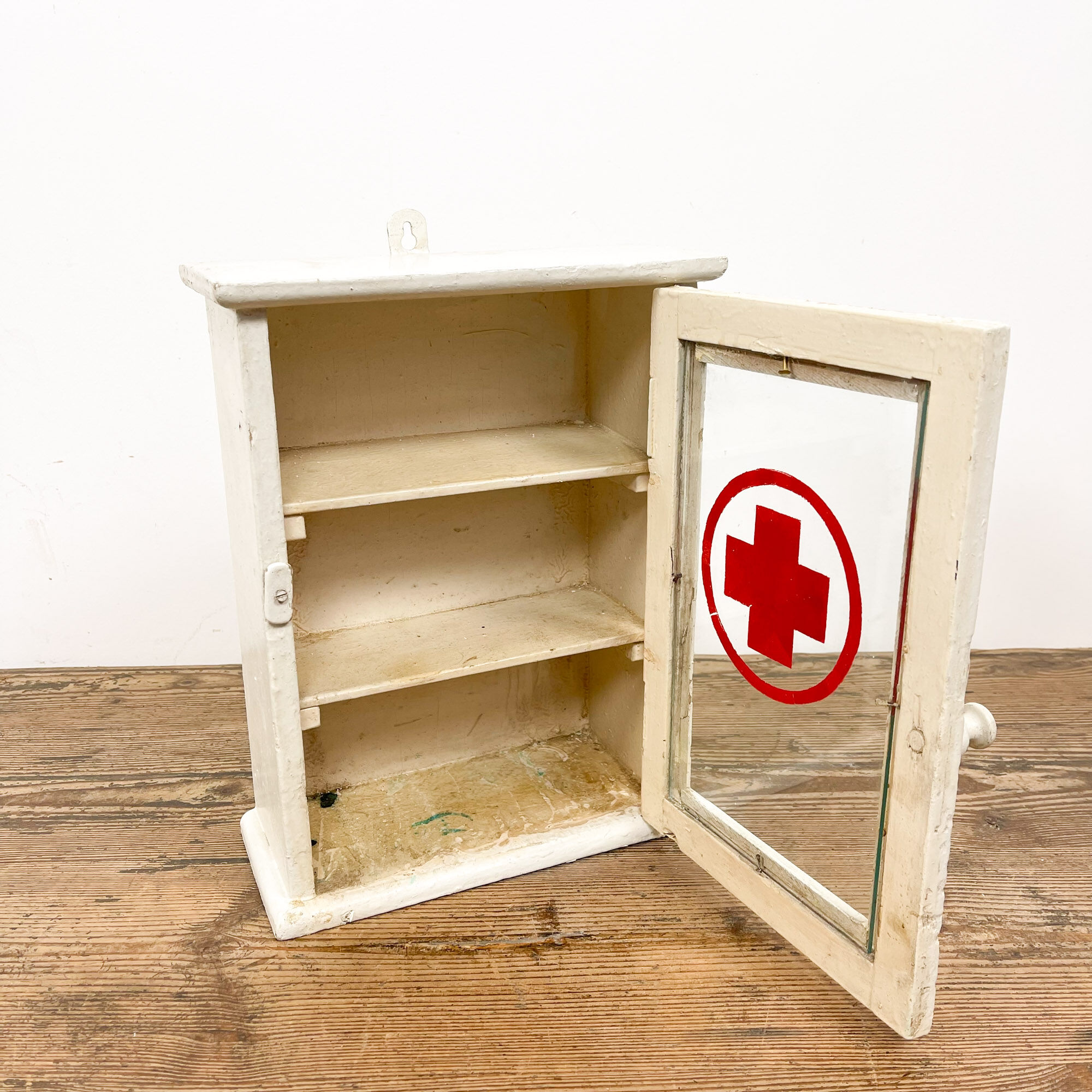 Vintage medicine cabinet red cross glass door