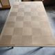 Oak dining table with a checkerboard top and extensions.