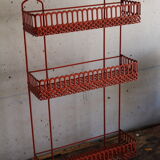 Vintage shelf in red openwork metal