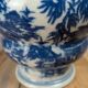 Blue and white Chinese vase with sculpted handles and landscape decoration.