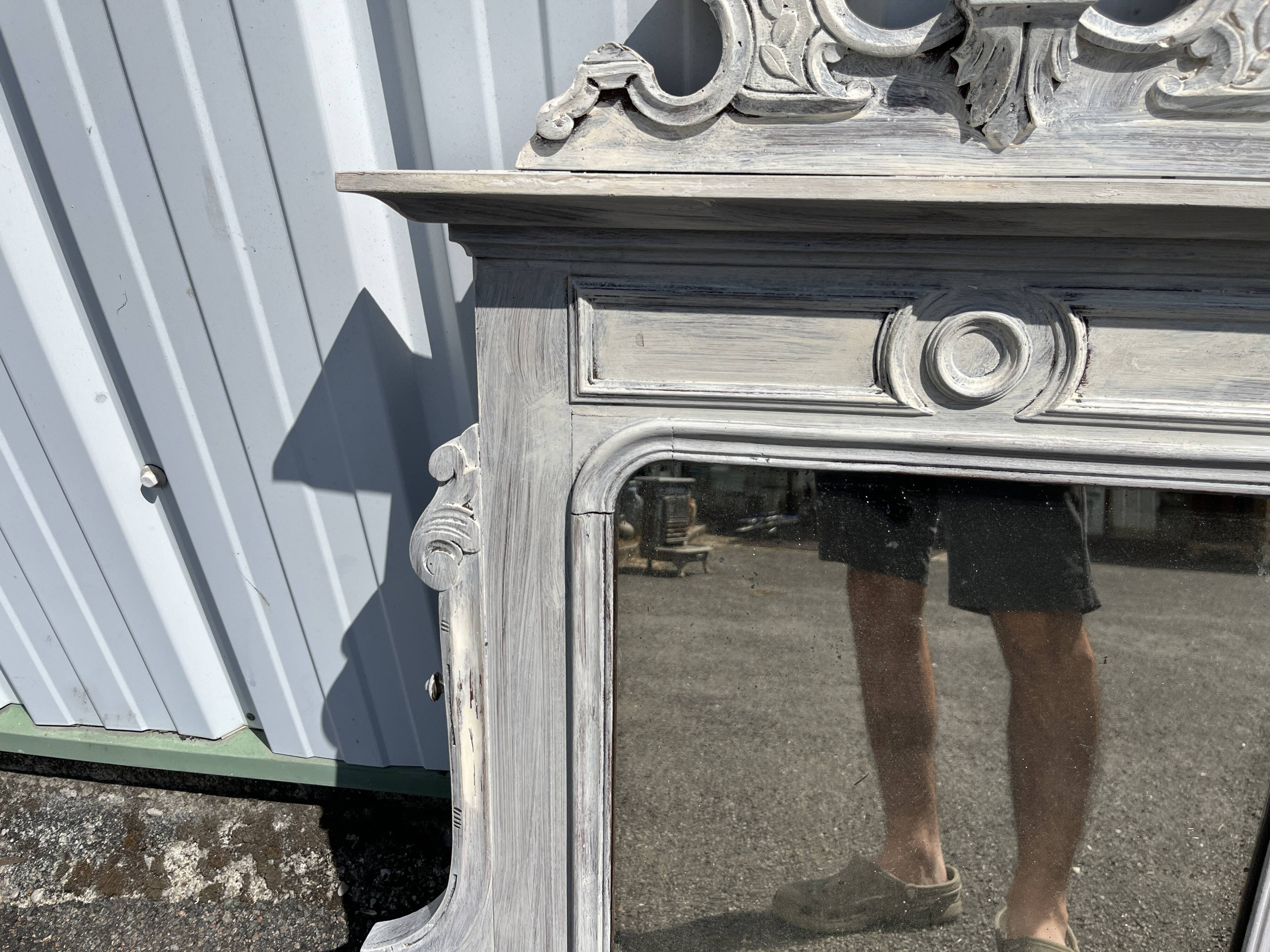Large decorative mirror in carved wood with shabby patina