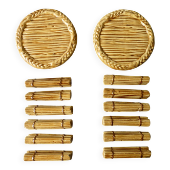 12 knife rests and 2 bottle coasters in earthenware