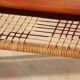 Vintage Scandinavian coffee table in teak and rattan – Danish design from the 1960s.