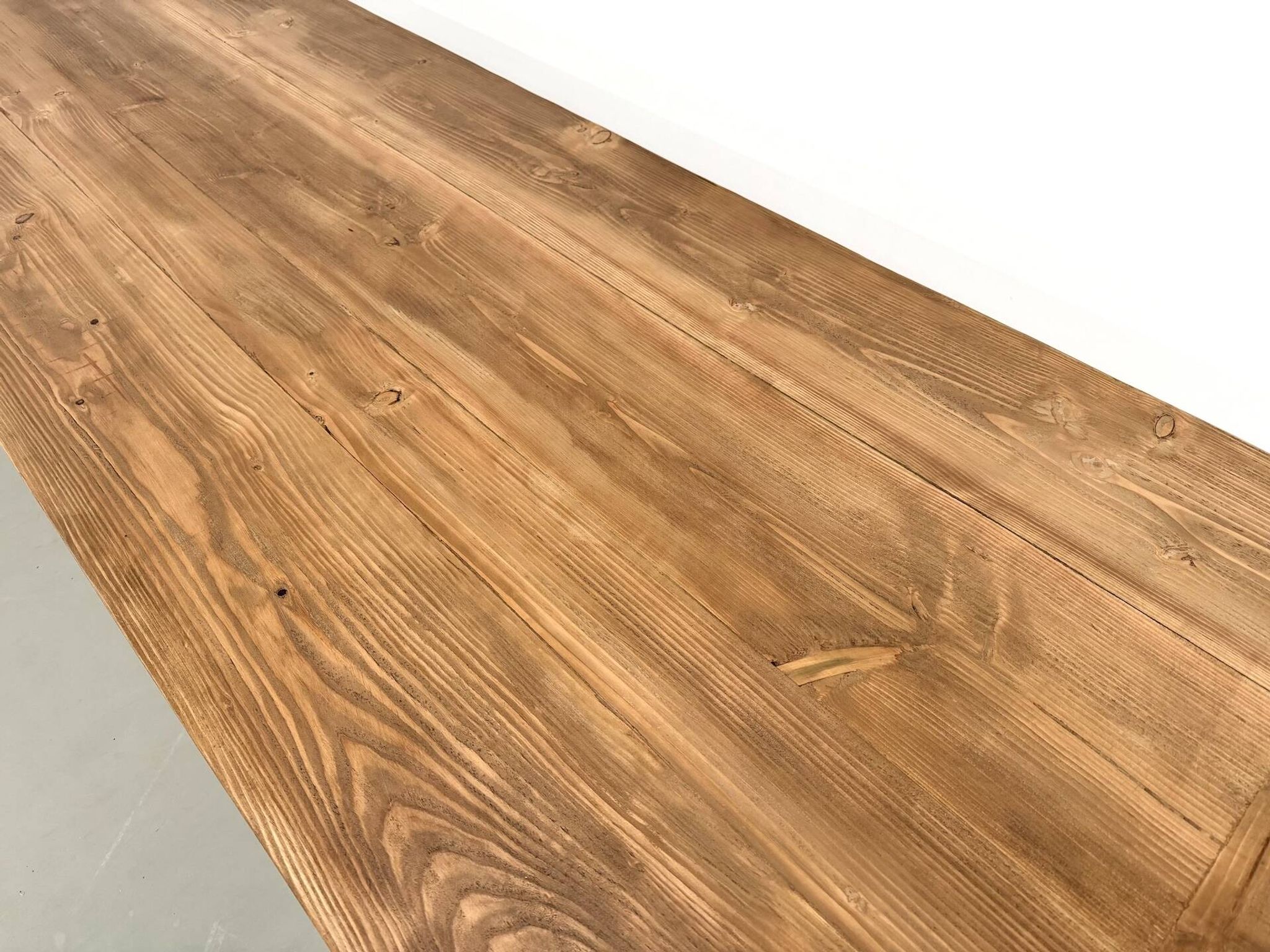 Refectory table in solid pine and beech, with X-shaped legs.