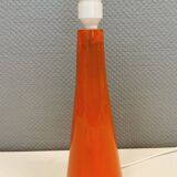Ceramic table lamp with partial orange glaze.