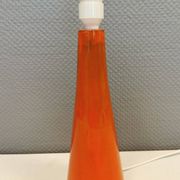 Ceramic table lamp with partial orange glaze.
