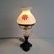 1960s Czechoslovakian milk glass oil lamp style table lamp with red windmill