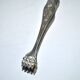 Vintage silver metal sugar or ice cube tongs with engraved lion claw decoration