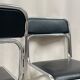 4 chrome metal chairs with black faux leather, 1990