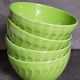 Four vintage spring green earthenware bowls