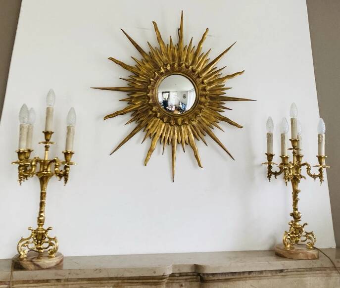 Pair of gilt bronze chandeliers, marble bases.
