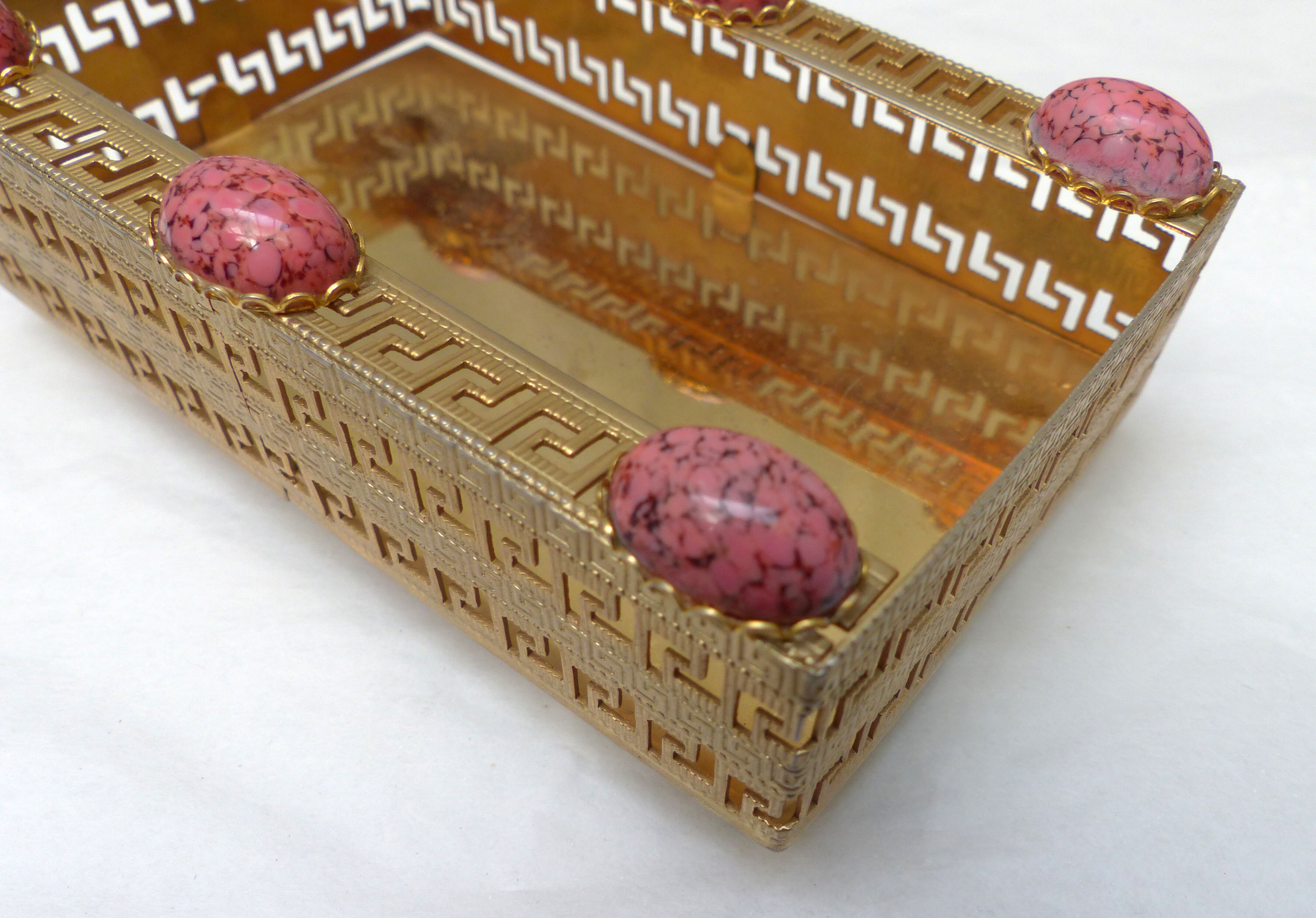 Golden metal catchall with pink stones