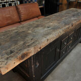 Former 1930 carpenter's workbench has black patinated doors and drawers