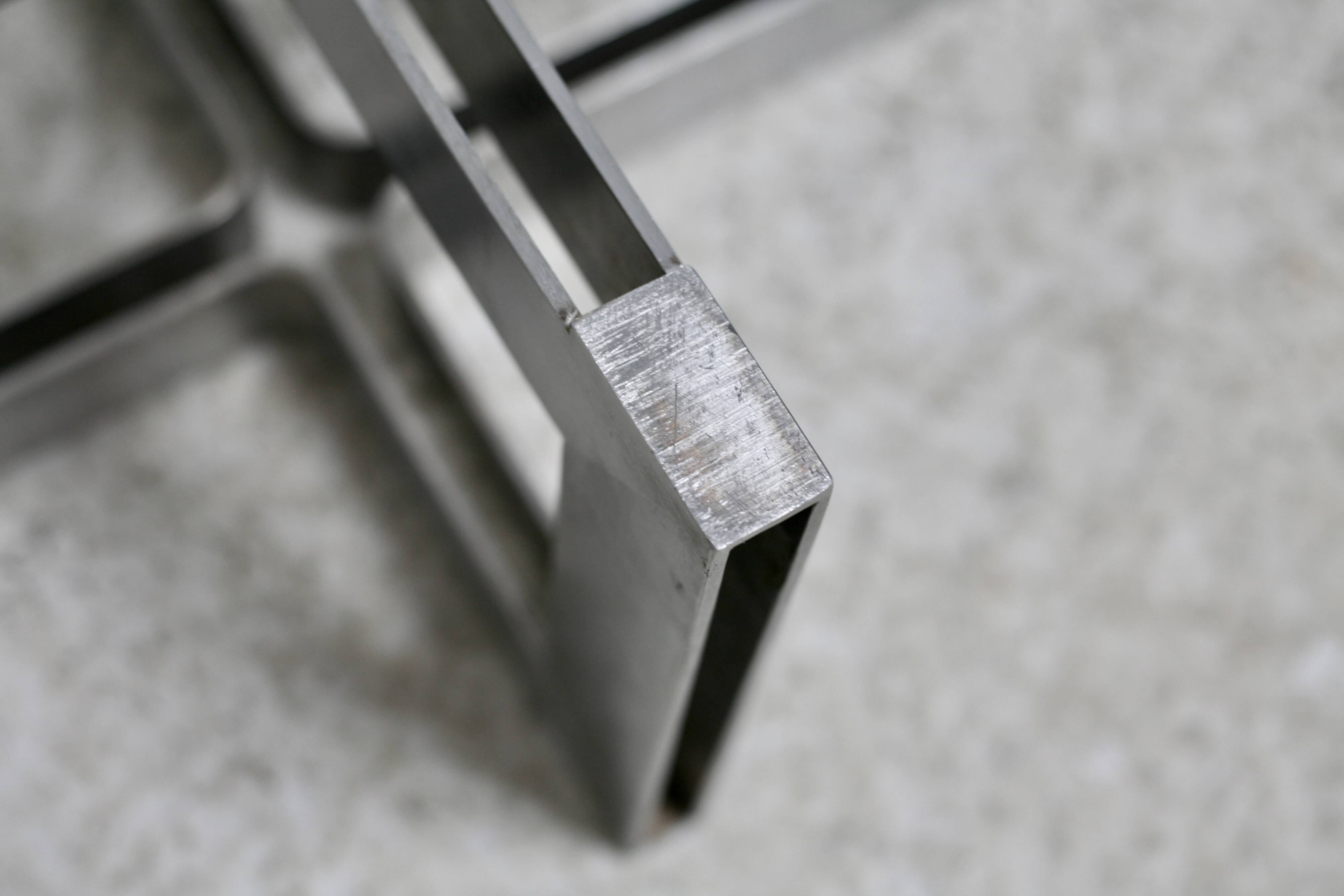 Coffee table with steel base and smoked glass slab. Circa 197