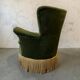 Vintage moss green cocktail chair with fringes.