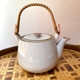 Vintage teapot in stoneware handle in rattan