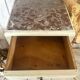 White patinated bedside table with a marble top