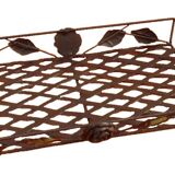 Rectangular metal serving tray with floral decoration.