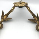 Antique bronze wall light with arm decorated with swans and palmettes in the Empire style