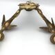 Antique bronze wall light with arm decorated with swans and palmettes in the Empire style
