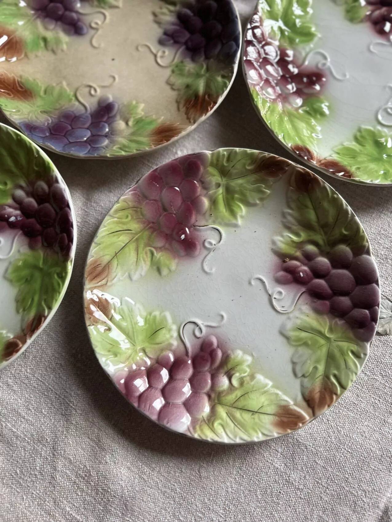 Set of eight flat dessert plates in barbotine earthenware with grape decoration – circa 1900.