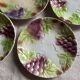Set of eight flat dessert plates in barbotine earthenware with grape decoration – circa 1900.